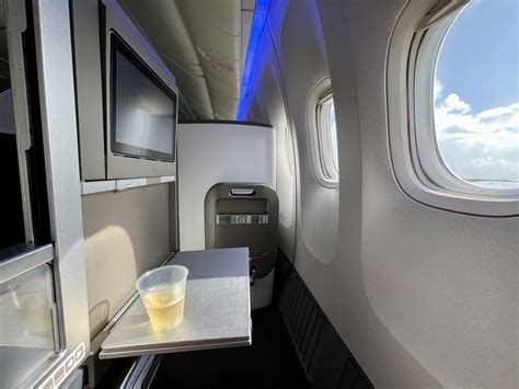 British Airways Club World cabin interior during meal service