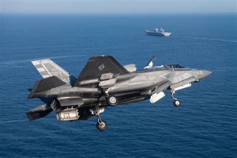 british officials inspecting f-35b aboard hms prince of wales in indo-pacific deployment