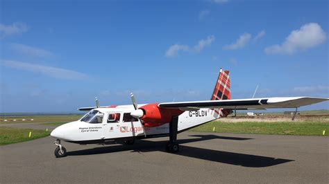 Britten-Norman Islander aircraft on a remote island airstrip