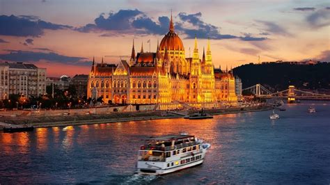 budapest parliament at sunset seen from danube river cruise