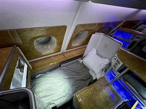 business class suite with lie-flat bed and privacy door onboard Emirates A380
