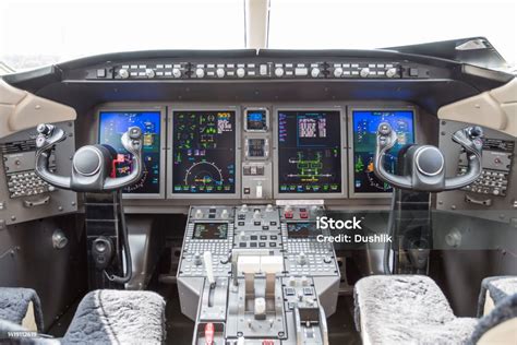 business jet cockpit with experienced corporate captain during preflight