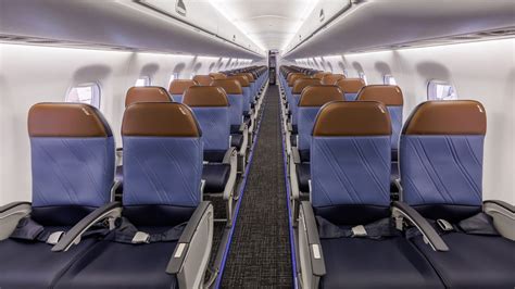 Business travelers boarding American Airlines Embraer 175 for SRQ-MIA route