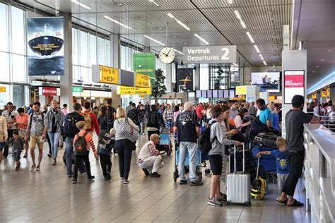 busy airport crowd summer travel 2025 high traffic