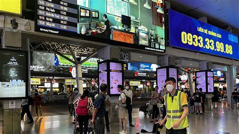 busy boarding gates at ho chi minh city airport during vietnam airlines summer travel season