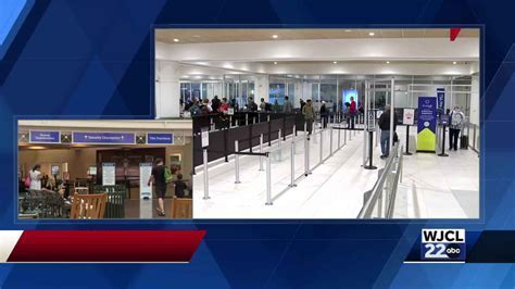 Busy check-in counters at Savannah/Hilton Head International Airport with various airline logos