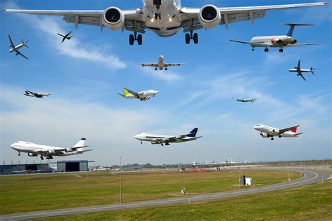 busy flight training airport with multiple aircraft in pattern and control tower in view