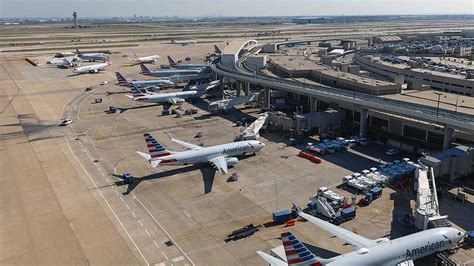 busy summer terminal with reduced flight boards