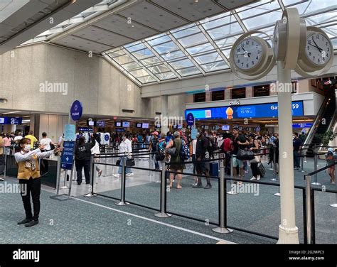 busy TSA checkpoint during summer travel surge 2025