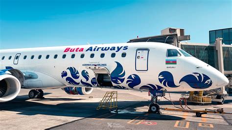 Buta Airways Embraer E-190 aircraft at regional airport terminal