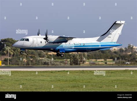 C-146A Wolfhound turboprop aircraft landing on rugged airstrip in remote terrain
