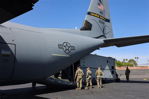 c-17 delivering heavy equipment to austere airstrip in combat zone