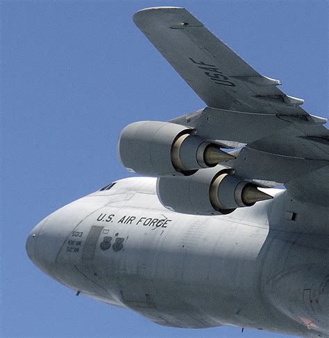 C-5 Galaxy heavy takeoff rotation with visible exhaust distortion