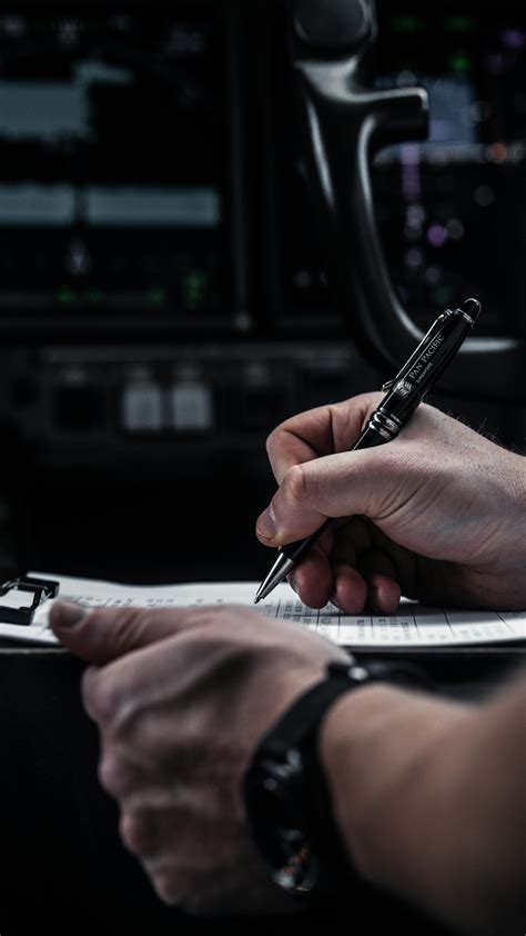 cabin crew completing paperwork after international flight arrival