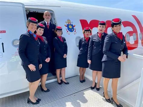 Cabin crew of Malta Air preparing for boarding at Malta International Airport