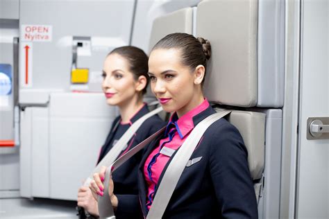 cabin crew preparing premium cabin ahead of departure to Shanghai at Auckland airport gate