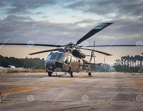California helicopter pilot preparing for takeoff near mountain range at dusk