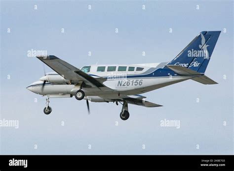 Cape Air Cessna 402 piston aircraft landing at coastal regional airport at dusk