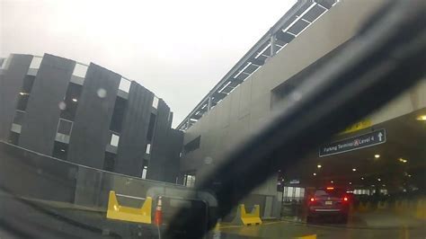 car rental return lot near EWR Airport under overcast skies