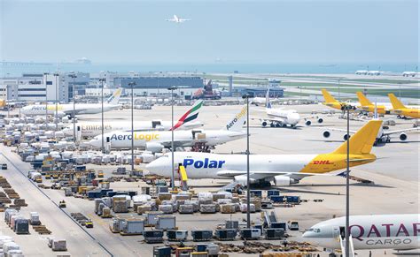 cargo aircraft loading at hong kong international airport cargo terminal at night