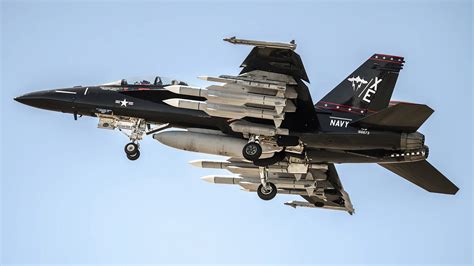 Carrier-based F/A-18E launching with afterburner engaged