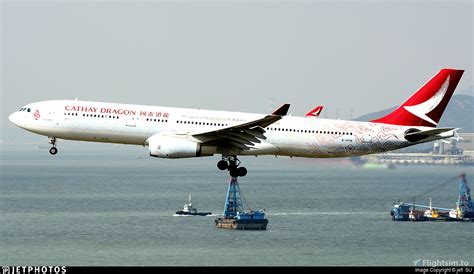 Cathay Dragon A330 in hybrid livery taxiing in Hong Kong