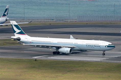 Cathay Pacific Airbus A330-300 at Hong Kong International Airport terminal