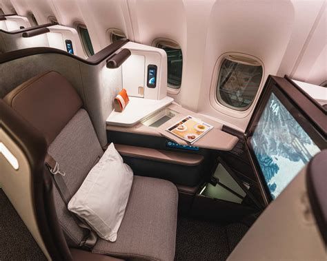Cathay Pacific Aria Suite minimalist cabin design soft tones privacy door