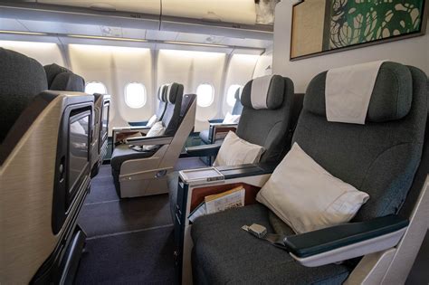 Cathay Pacific business class cabin representing oneworld Emerald benefits