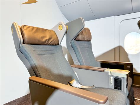 Cathay Pacific premium economy seat with calf rest footrest and reclining seat design