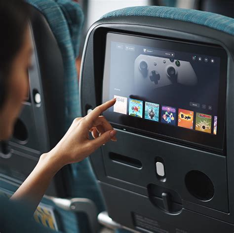 Cathay Pacific seatback entertainment screen Asian movie library interface cabin