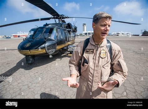 CBP air interdiction helicopter over coastal border zone near San Diego