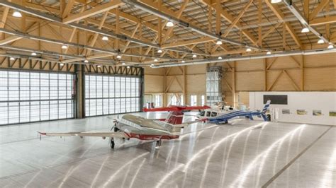 CCSF aircraft maintenance hangar with students in lab coats during training session
