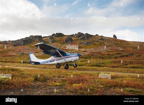 cessna 206 on bush airstrip in Alaska