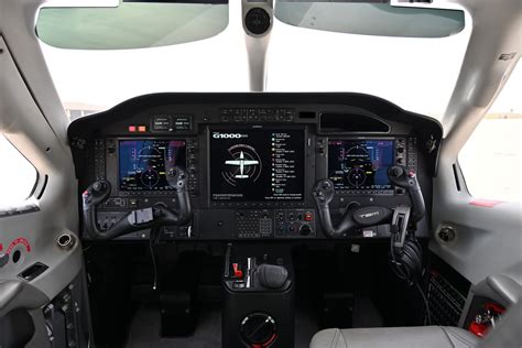 cessna 208 cockpit with garmin g1000 avionics system illuminated
