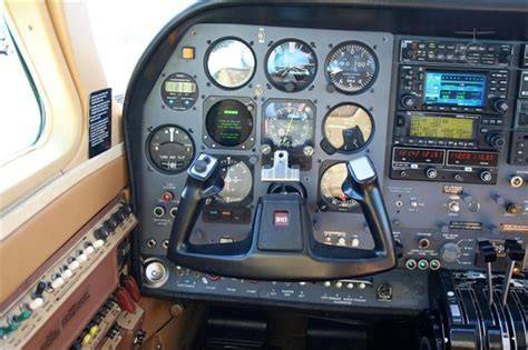 cessna 310 cockpit with advanced avionics and leather trim
