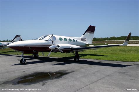 cessna 414a chancellor parked on private airstrip at dusk