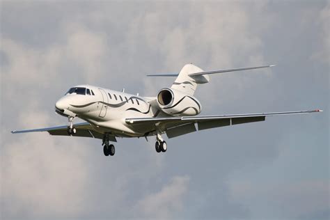 Cessna Citation X+ private jet with swept wings at high speed
