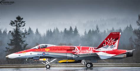 CF-18 Hornet painted in Canadian Air Force livery, flying over Arctic landscape
