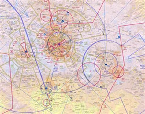 CFI and student pilot reviewing aeronautical charts together