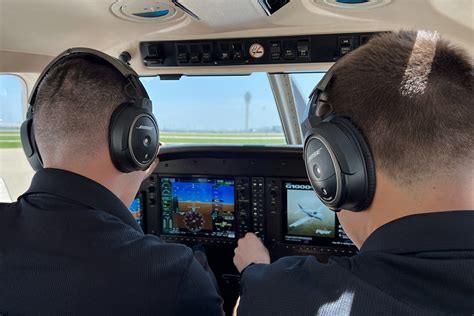 cfi reviewing solo cross-country flight plan with student pilot