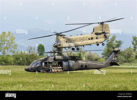 CH-47F Chinook and UH-60M Black Hawk performing joint lift operation in Northern Territory