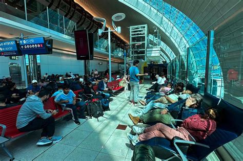 chaotic airport scene with stranded passengers in Amman during flight crisis