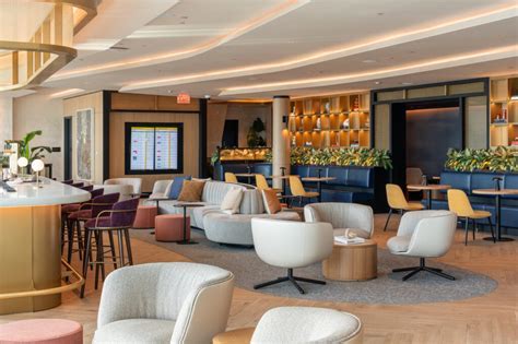Chase Sapphire Lounge interior with passengers relaxing at PHX Terminal 4