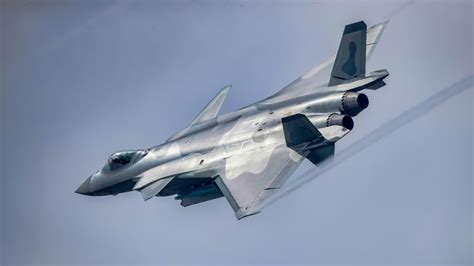Chengdu J-20 Mighty Dragon banking with afterburners