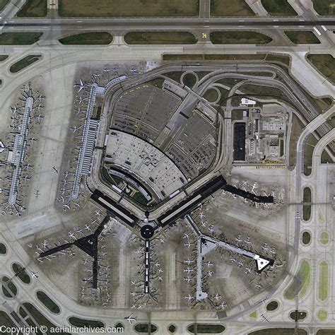 Chicago O’Hare airport terminals aerial view with American and United aircraft at gates