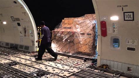 China Airlines Boeing 777F loading cargo pallets during night operations