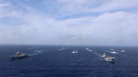 chinese naval officers conducting carrier operations onboard shandong in western pacific