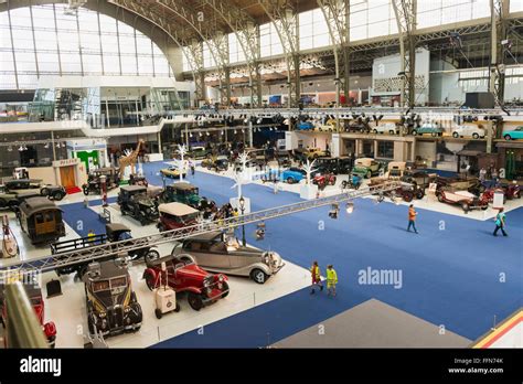 classic cars on display inside Autoworld Brussels