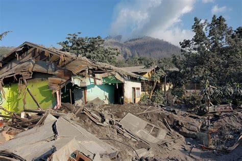 cleanup efforts begin in ash-covered village near Mount Lewotobi after eruption